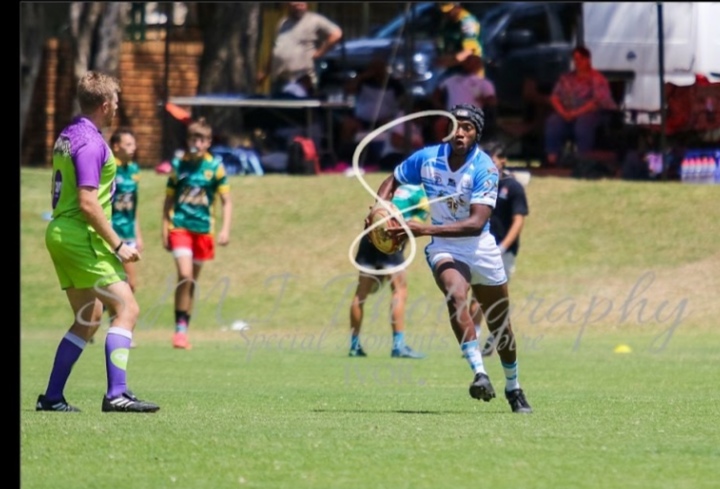 Nolo Buthelezi attacking with the ball in hand during a match