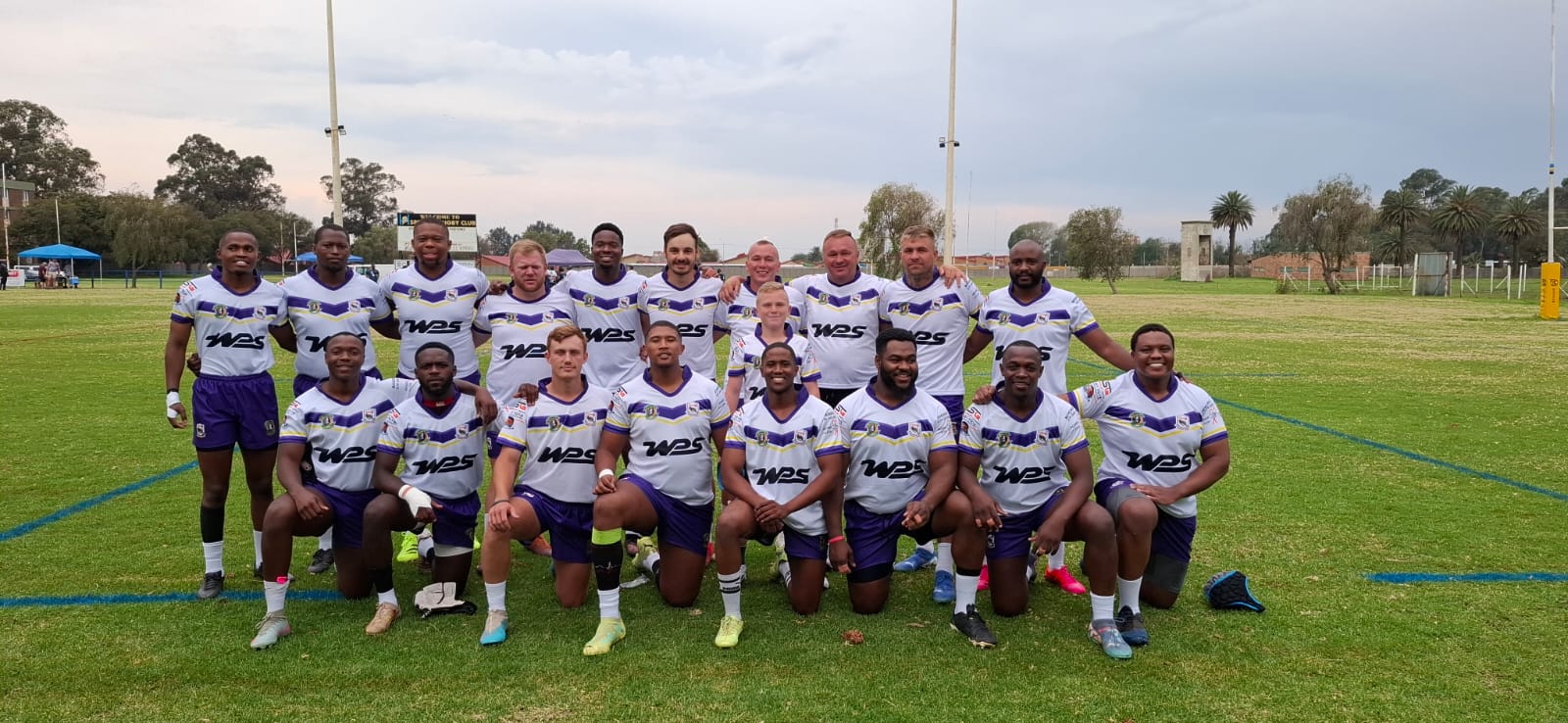 Nolo Buthelezi with his rugby squad on the field after a fixture